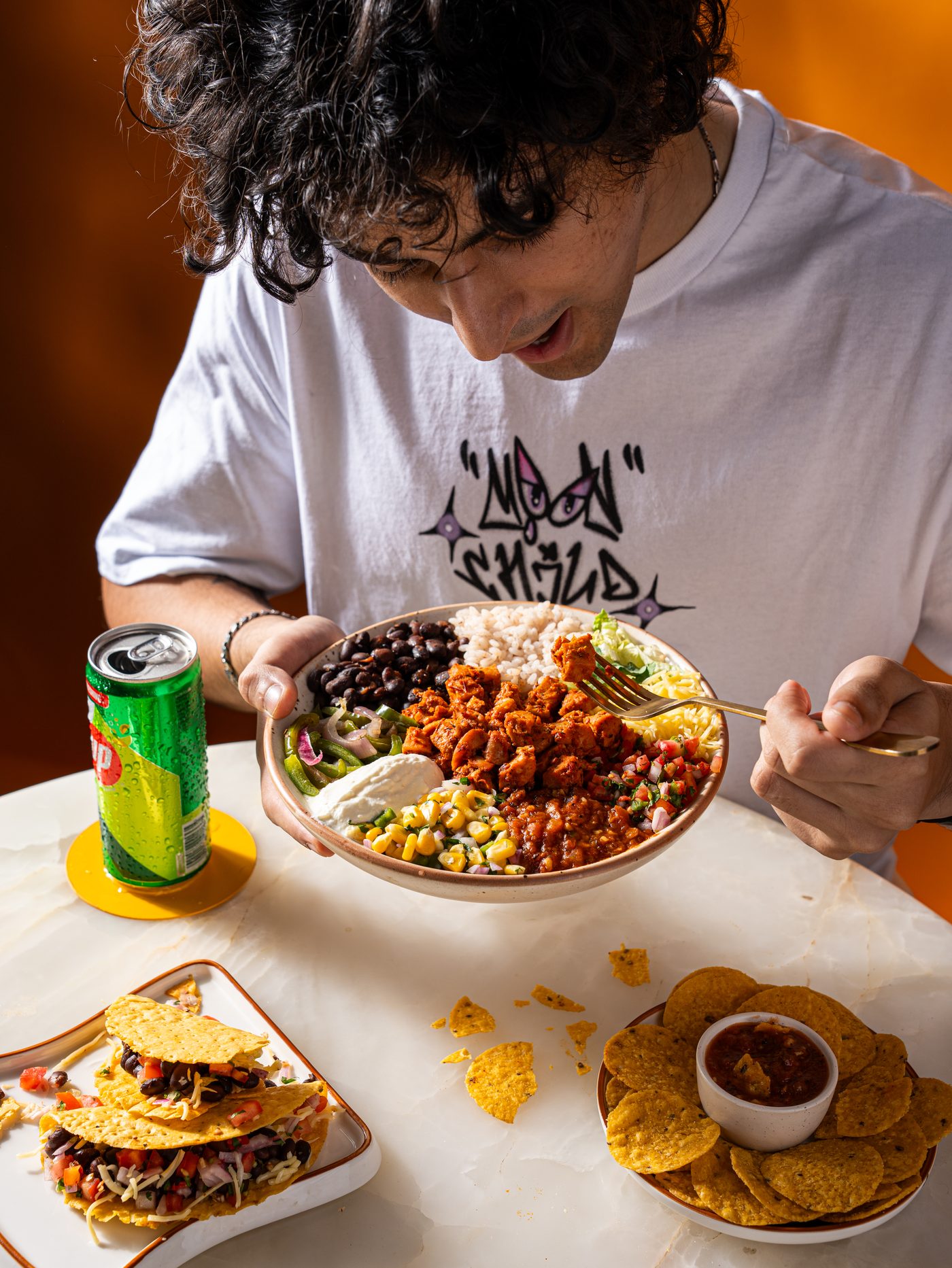 Maiz burrito bowl with black beans, salsa, and fresh toppings